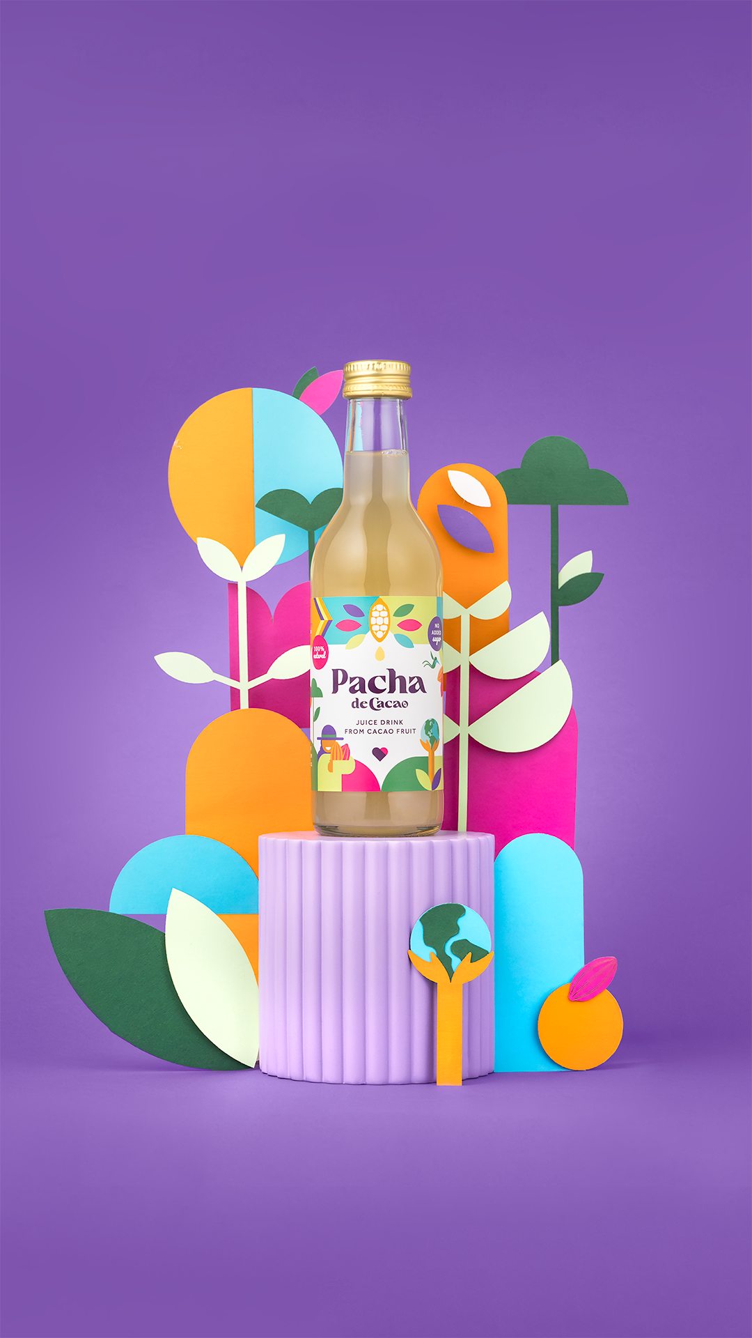 Styled images showcasing the Pacha de Cacao bottle on top of a pillar with colourful branded elements around it